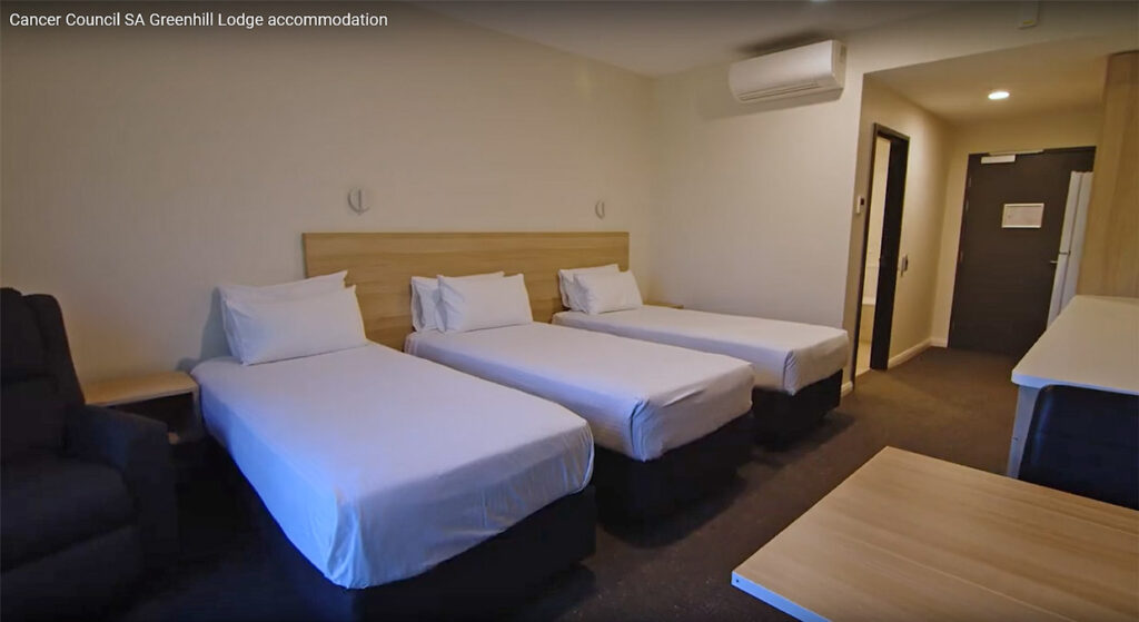 Picture showing clean comfortable room with 3 beds at the Cancer Council Greenhill Lodge 